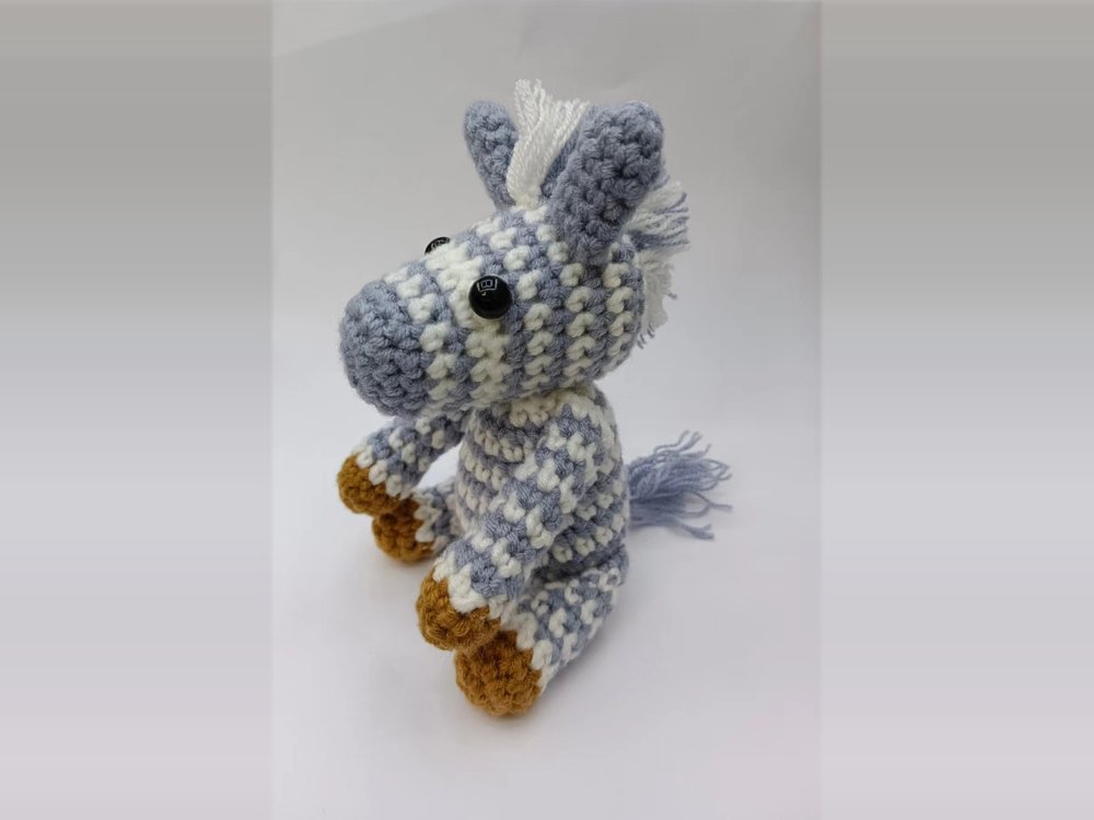 Finished crochet zebra from the beginner kit