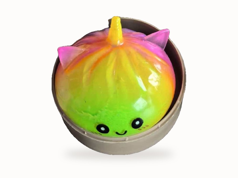 Rainbow unicorn bun squishy in its little steamer