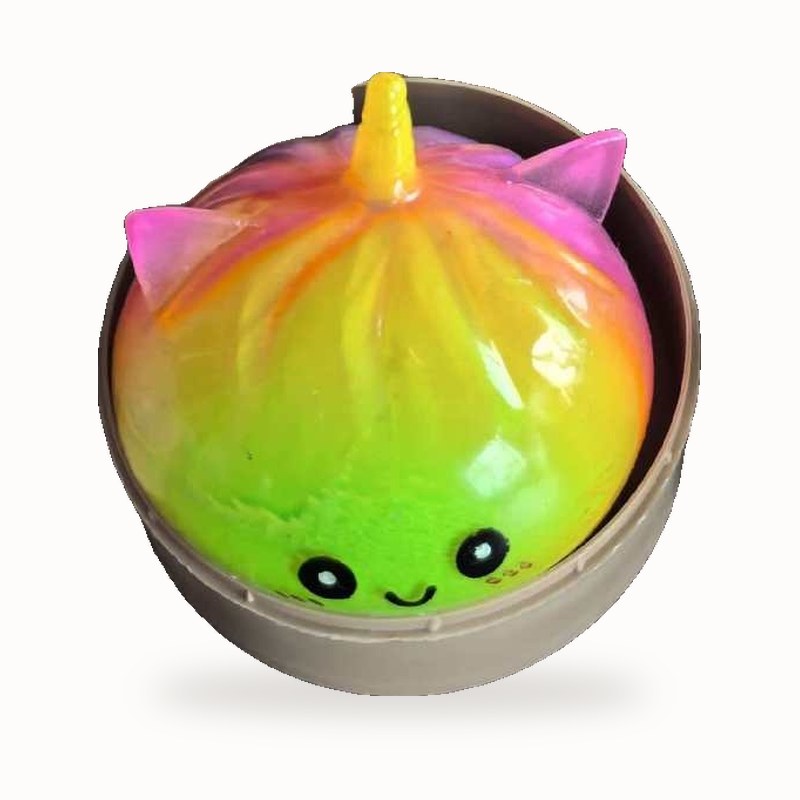 Rainbow Unicorn Bun squishy in its little steamer